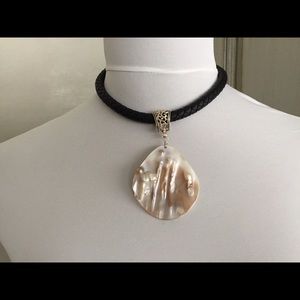 Leather braided necklace with shell pendant